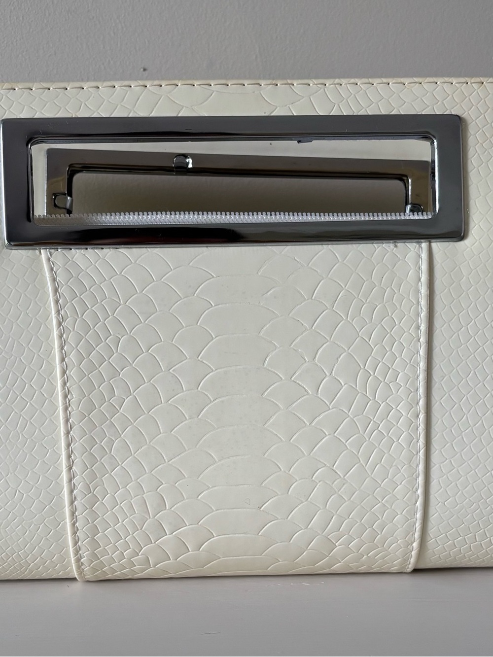 Elegant Cream Textured Clutch with Silver Hardware